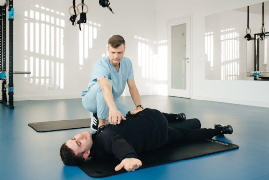 A patient doing exercise with a physiotherapist.